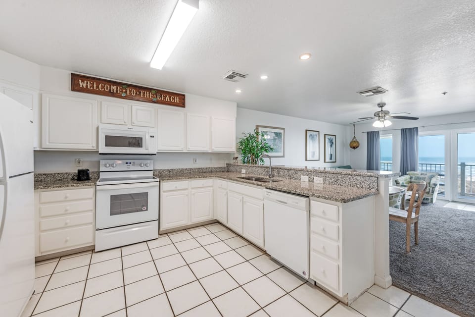Your spacious kitchen features granite countertops and modern appliances, perfect for preparing meals while enjoying ocean views.