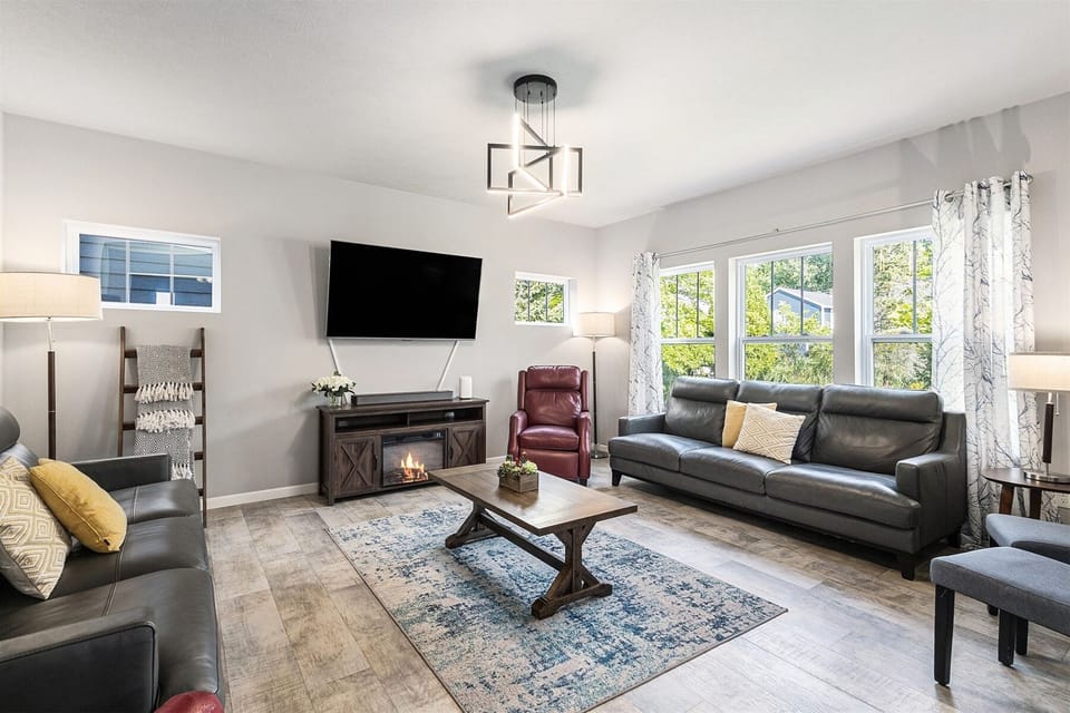 The living room offers plenty of comfortable seating for the whole group