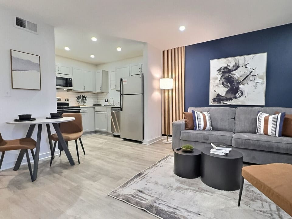 Sink into plush, comfortable seating and admire the artistic wall décor that inspires both creativity and relaxation, perfect for a short term rental.