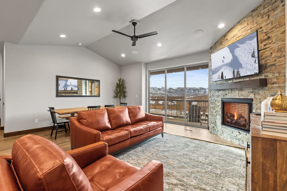 Great room with gas fireplace and balcony