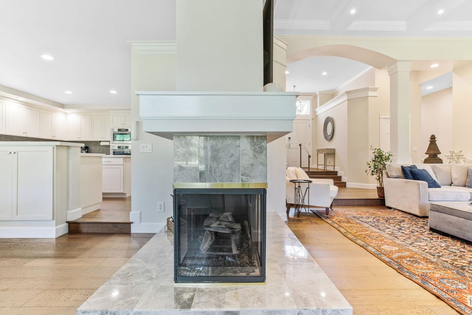 Cozy up by the fire, enjoying its warm glow and relaxing ambiance.
