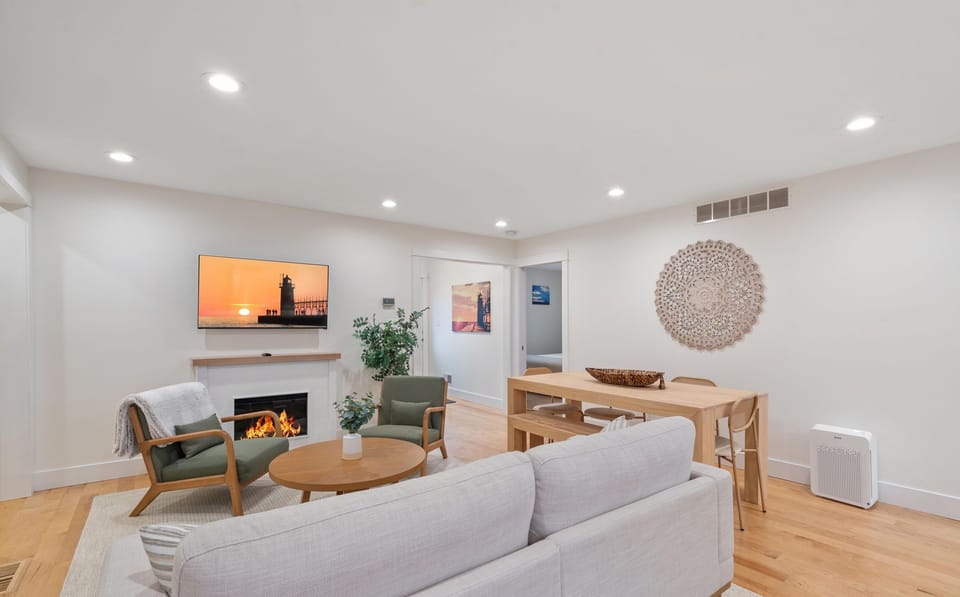 Walk through the front door to this elegant space with a cozy fireplace and shared sitting and dining space.