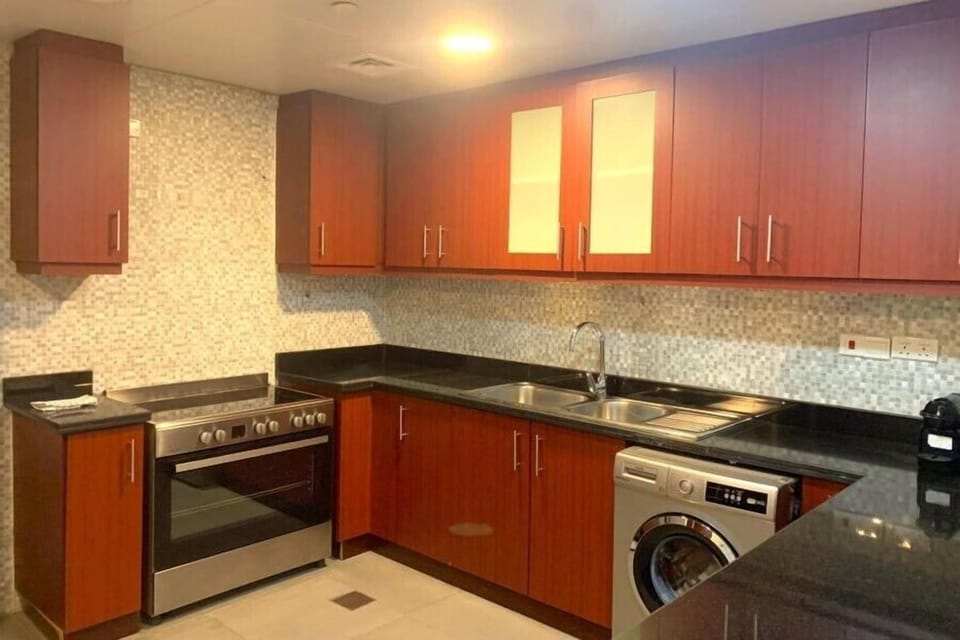 Family Apartment, Beach View | Private kitchen | Full-size fridge, microwave, oven, stovetop