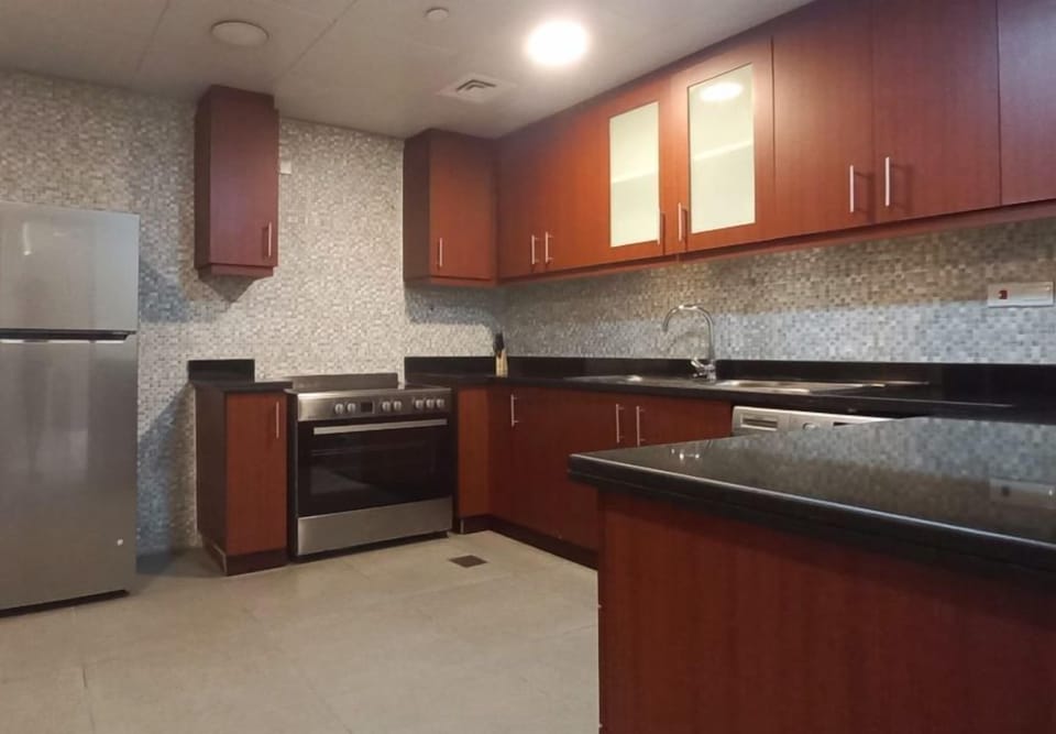 Family Apartment, Beach View | Private kitchen | Full-size fridge, microwave, oven, stovetop