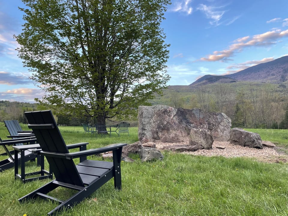Gorgeous new fire pit with 4 Adirondack chairs, table, firewood supplied.