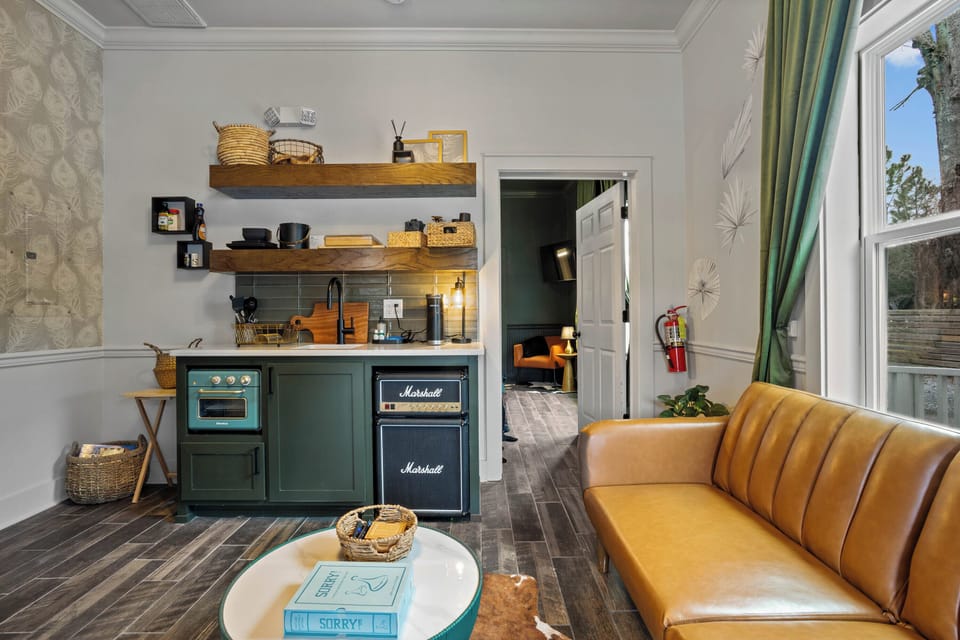 Living room, kitchen and full futon sofa sleeper