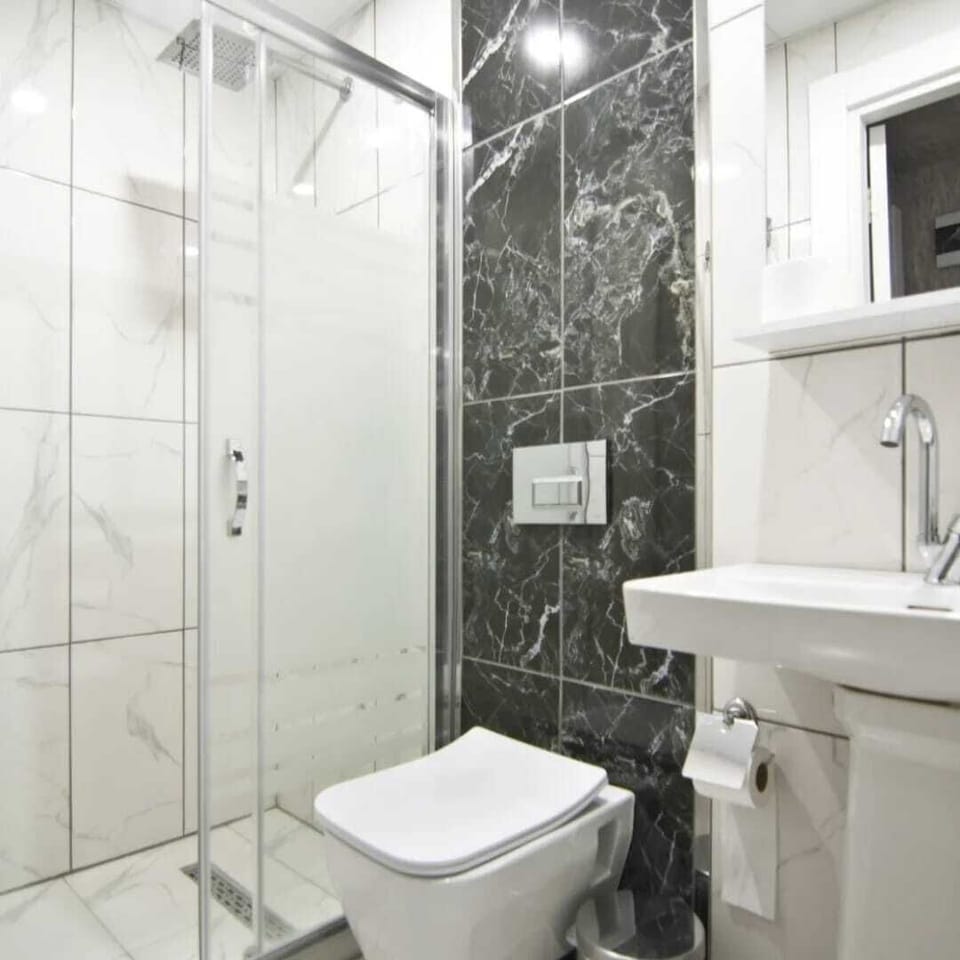 Shower, hair dryer, slippers, towels
