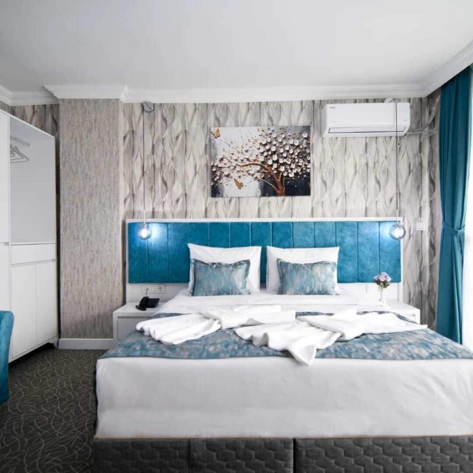 Classic Double Room, Balcony, City View | In-room safe, desk, laptop workspace, iron/ironing board (on request)