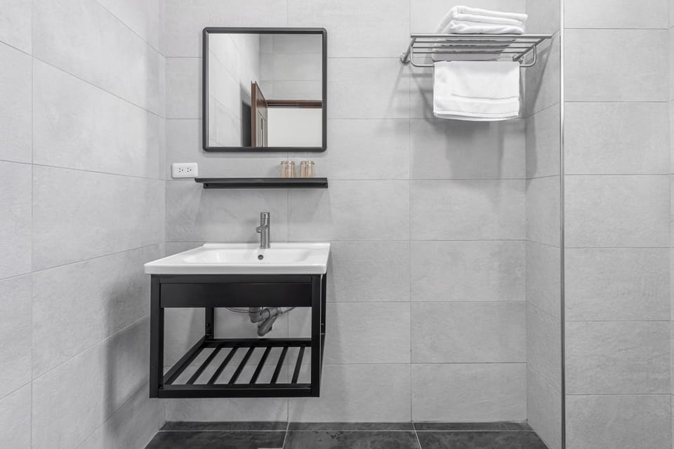Double Room | Bathroom | Shower, hair dryer, slippers, towels