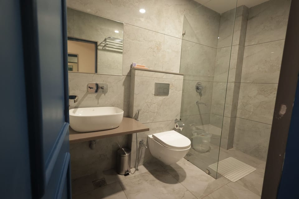 Nirvana Family Suite | Bathroom | Shower, free toiletries, towels, soap