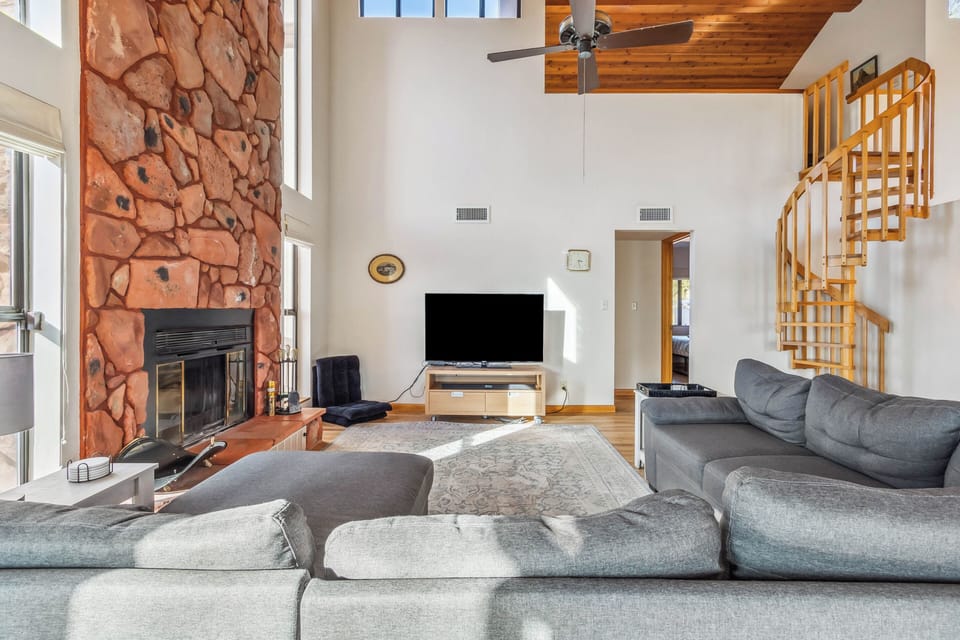 Living area boasts a spacious and cozy sectional couch