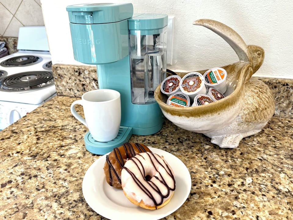 Jump-start your day at the coffee bar with teas, coffee, sugar, and creamer.