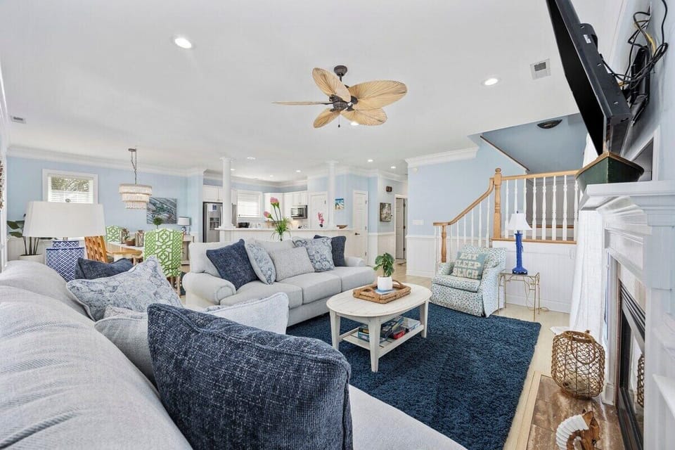 Bright and airy coastal retreat – relax in style, cozy seating, and elegant beachy vibes!