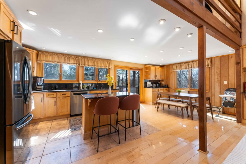 Cook and dine in style! Our fully stocked kitchen features a cozy dining area right beside it.