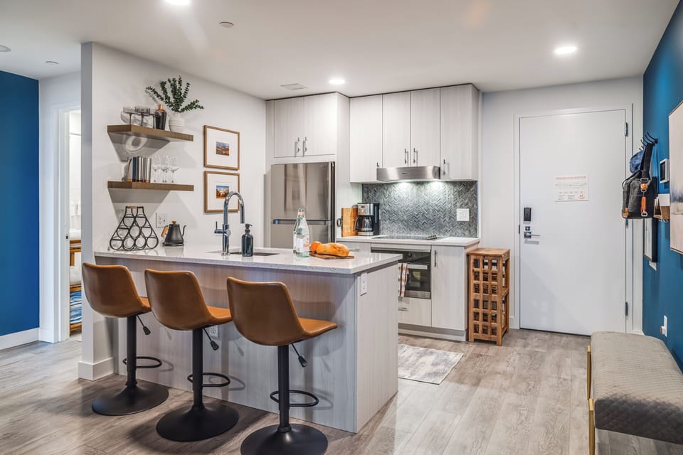 Kitchen features barstool seating.