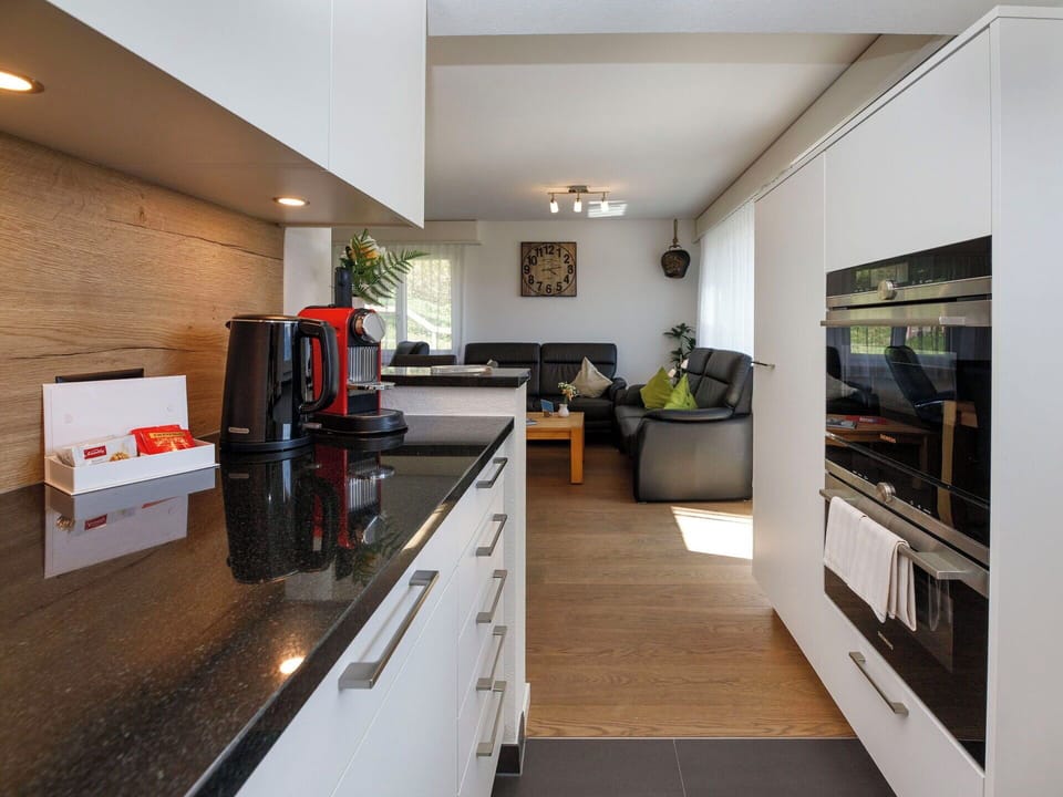 Furniture, Interior Design, Countertop, Kitchen, Flooring, Cabinetry, Wall, Kitchen Appliance, Floor, Wood