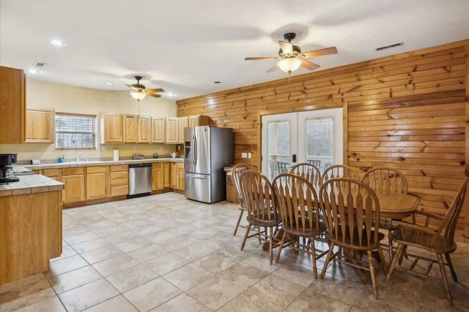 Oversized, spacious kitchen with modern stainless-steel appliances 