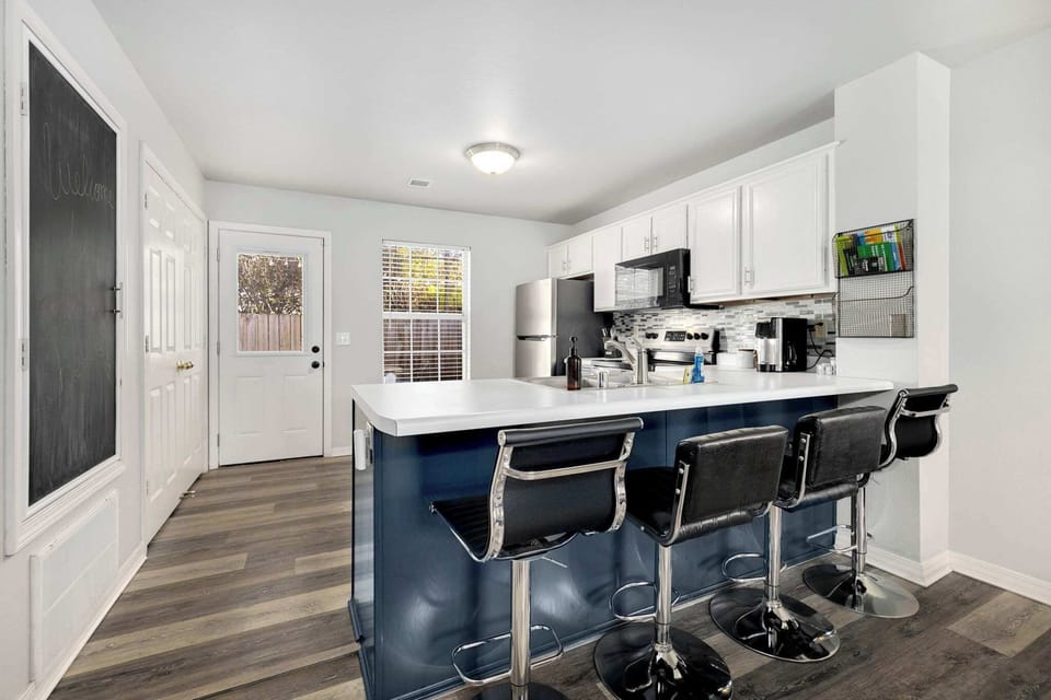 The kitchen is fully stocked to make a home cooked meal and enjoy at the kitchen island.