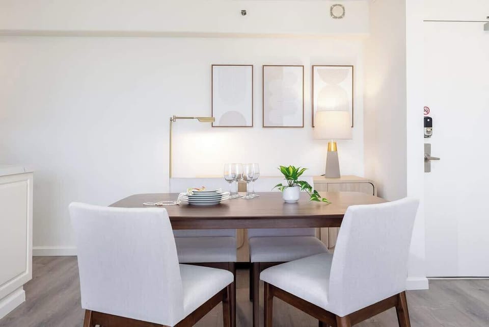 Enjoy your meals in our dining area, which features a table and four chairs.