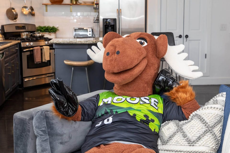 Kick back on the plush sofa in your bright, fully-equipped kitchen, where stainless steel appliances and modern finishes set the stage for your culinary adventures.