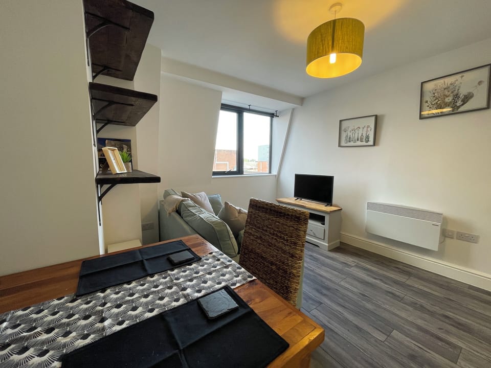 Comfort Apartment | Living area | 40-inch LCD TV with cable channels
