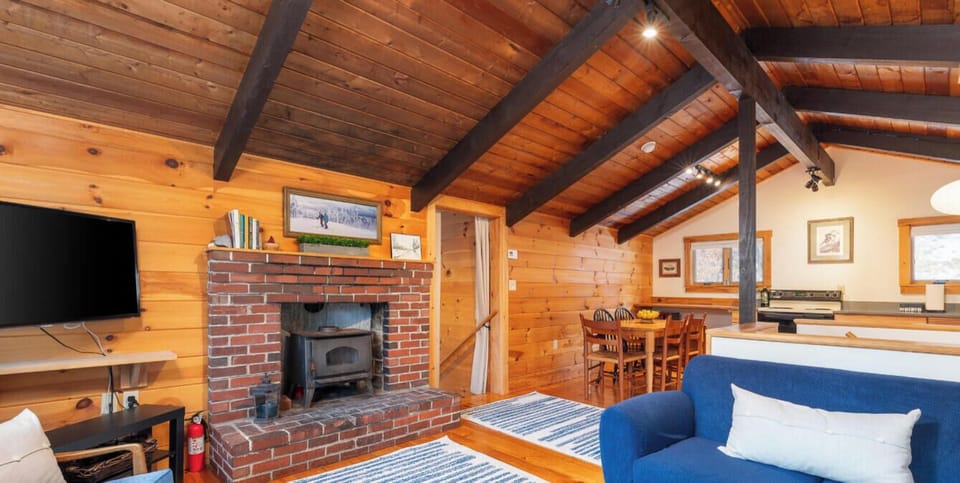 A bright and cozy living room with vibrant color, perfectly positioned to enjoy the views.