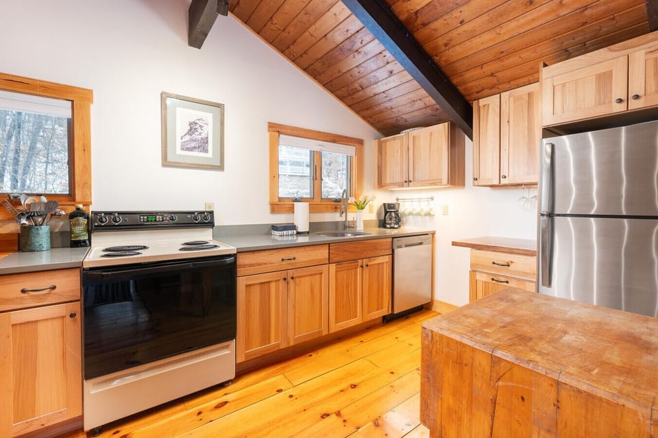 A modern and welcoming kitchen, perfect for preparing meals and making memories.