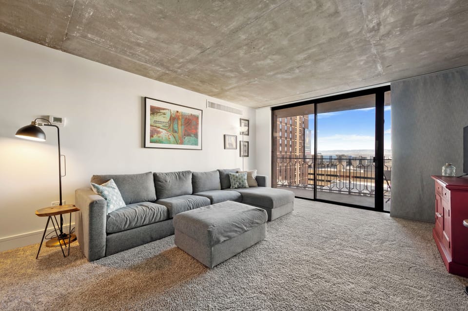 Open living space, views of the Rockies and a sectional couch with extra storage