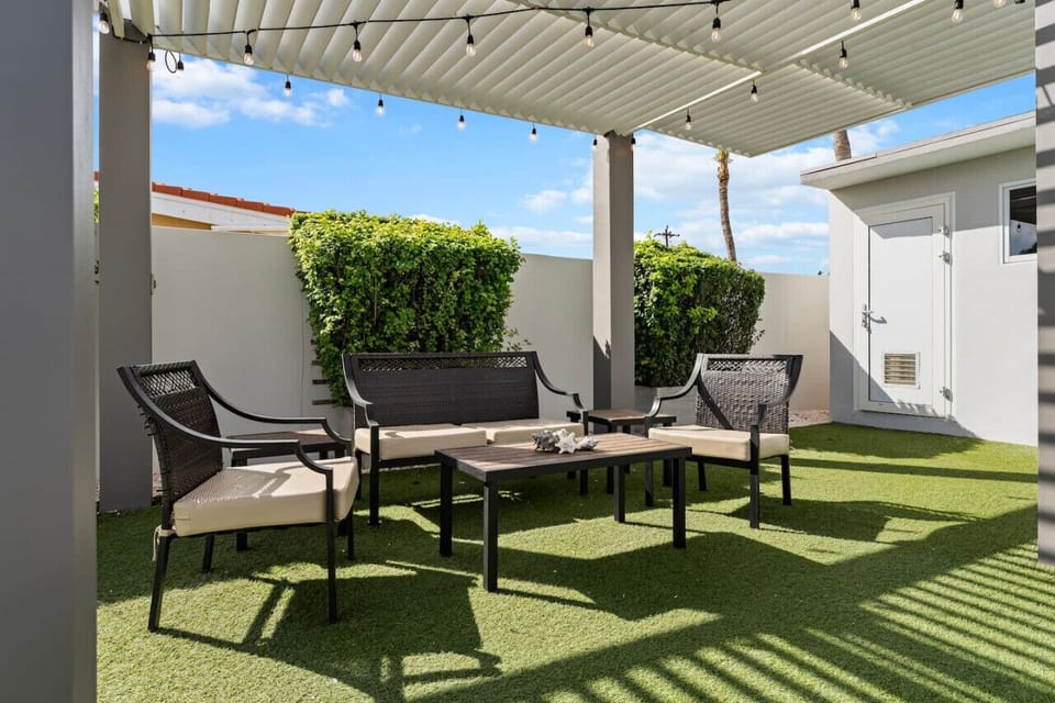 Cozy seating tucked away at the back of the garden, perfect for quiet moments or enjoying a morning coffee.