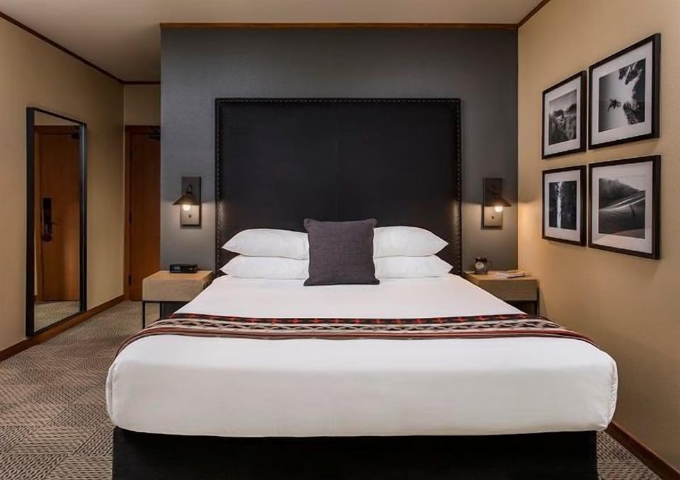 A stylish bedroom adorned with calming decor and soft textures, providing a peaceful space for a restful night.
