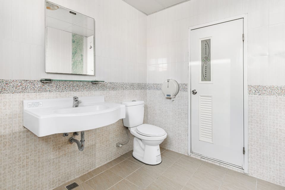Standard Family Room | Bathroom | Shower, hair dryer, slippers, towels