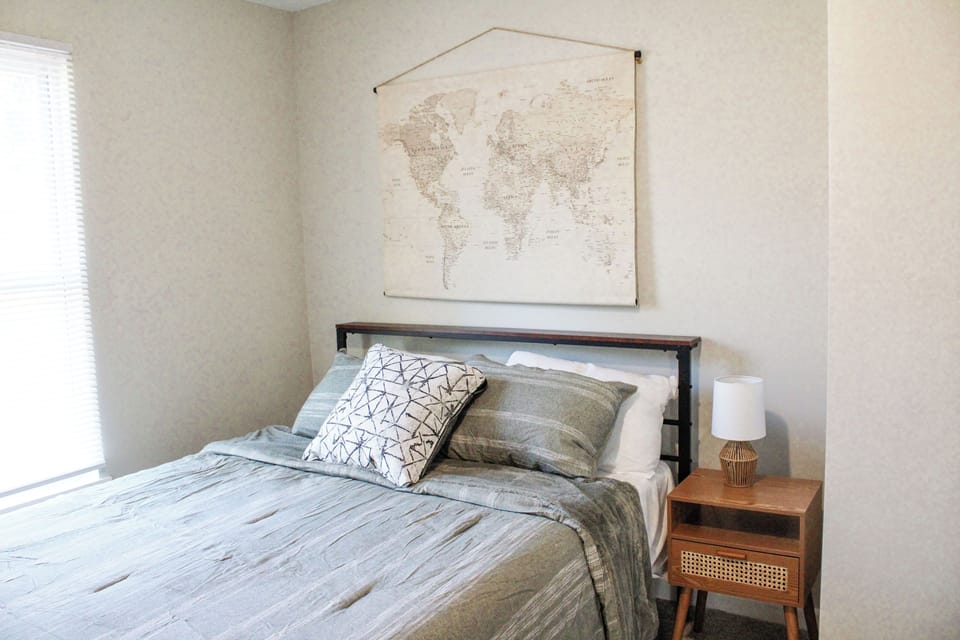 Queen bed with soft linens.
