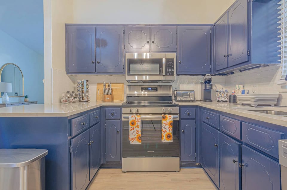 Whip up delicious meals in our fully equipped kitchen, complete with modern appliances and everything you need to feel right at home. #fullyequippedkitchen #vacationrental #cooking #kitchengoals