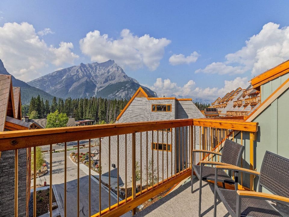 A private balcony with stunning mountain views, offering the perfect setting to relax and soak in the beauty of nature.