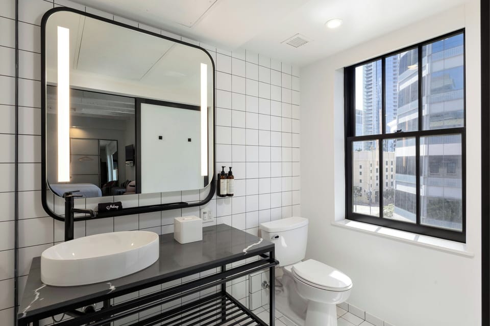 Suite, 1 King Bed with Sofa bed | Bathroom | Shower, designer toiletries, hair dryer, slippers