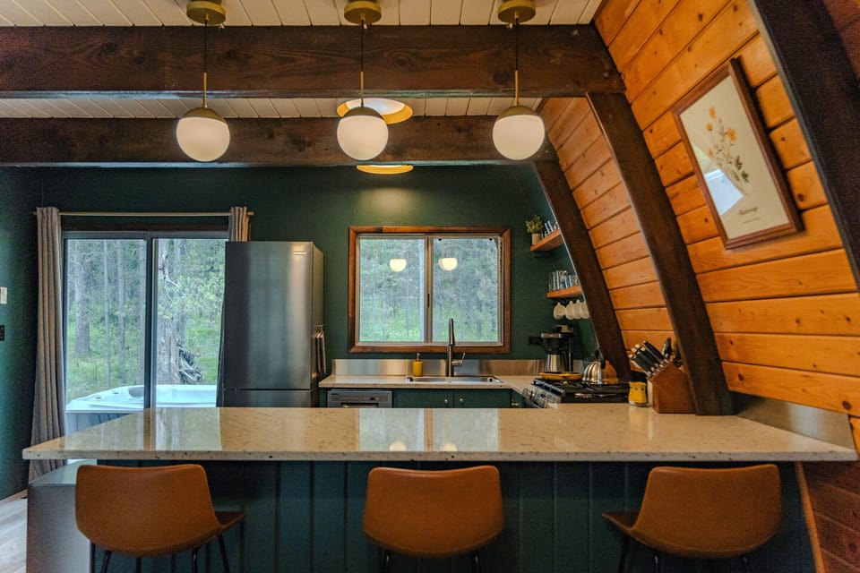The open design offers plenty of natural light downstairs (and quick access to the hot tub).