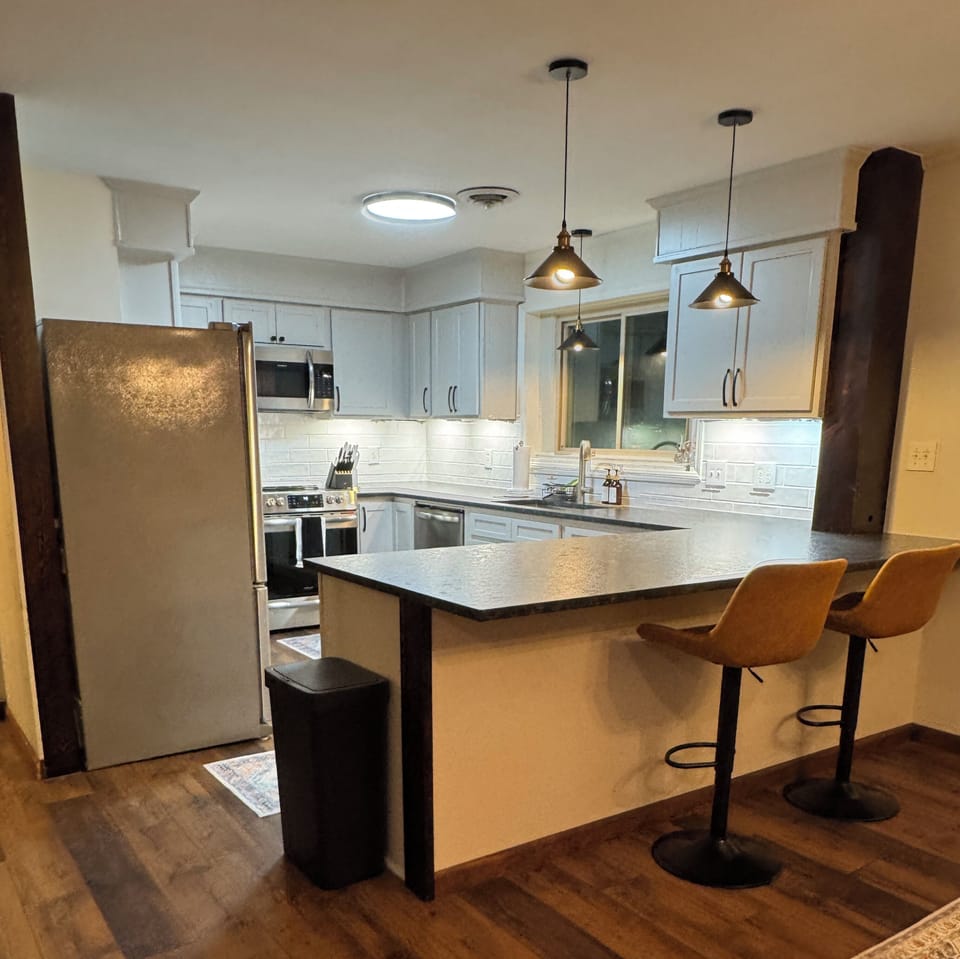 Charming kitchen with high-quality appliances and stocked with essentials