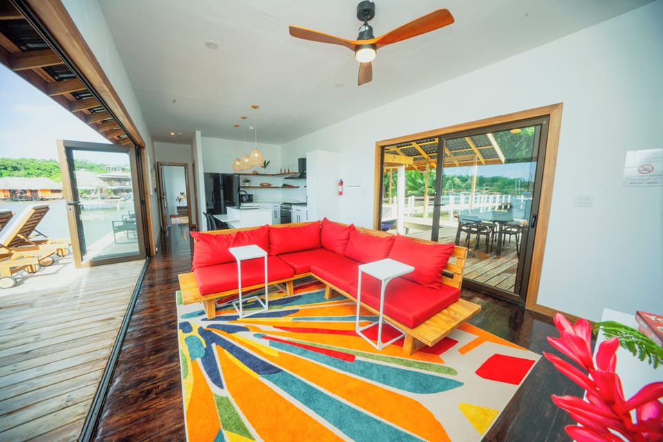 Living room with accordion doors that open to a beautiful view and a 50" SmartTV