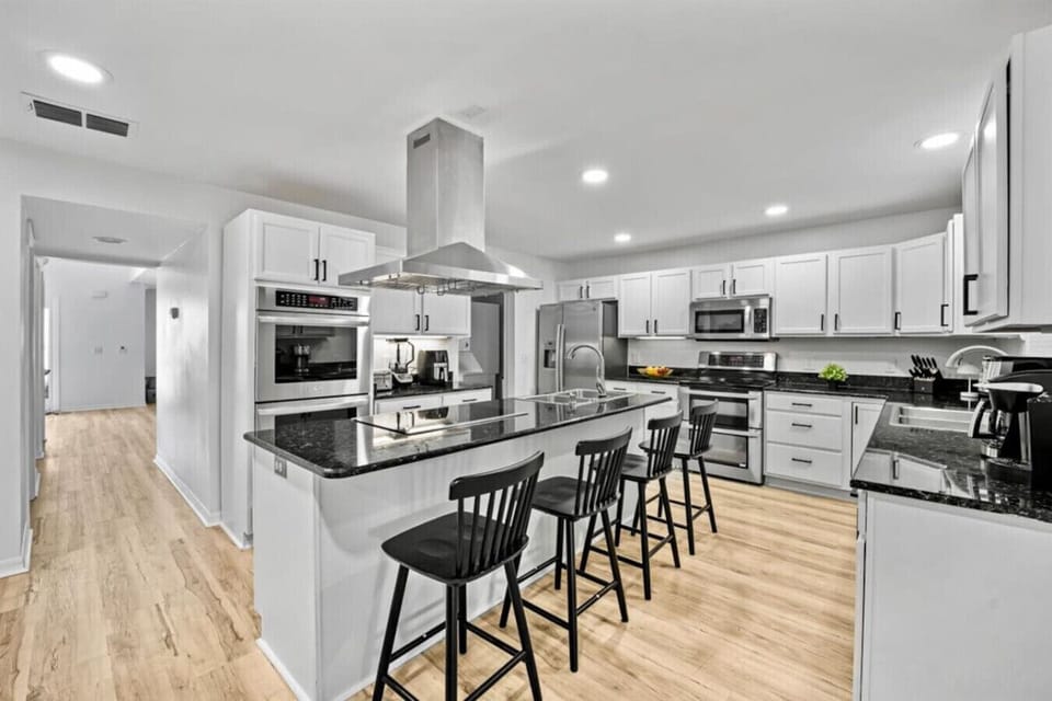 A chef`s dream kitchen with plenty of counter space, stainless steel appliances, and all the tools you need to recreate your favorite recipe.