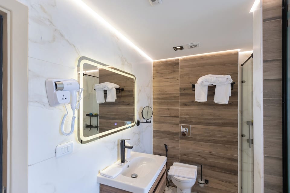 Honeymoon Suite, Balcony, Mountain View | Bathroom | Hair dryer, slippers, towels, soap