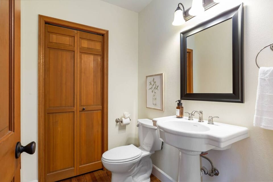Powder bathroom, located off kitchen