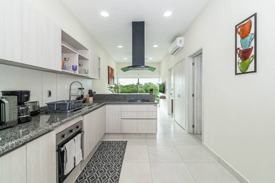 Cook up a feast or prepare a quick meal in this spacious, well-equipped kitchen designed for your convenience.