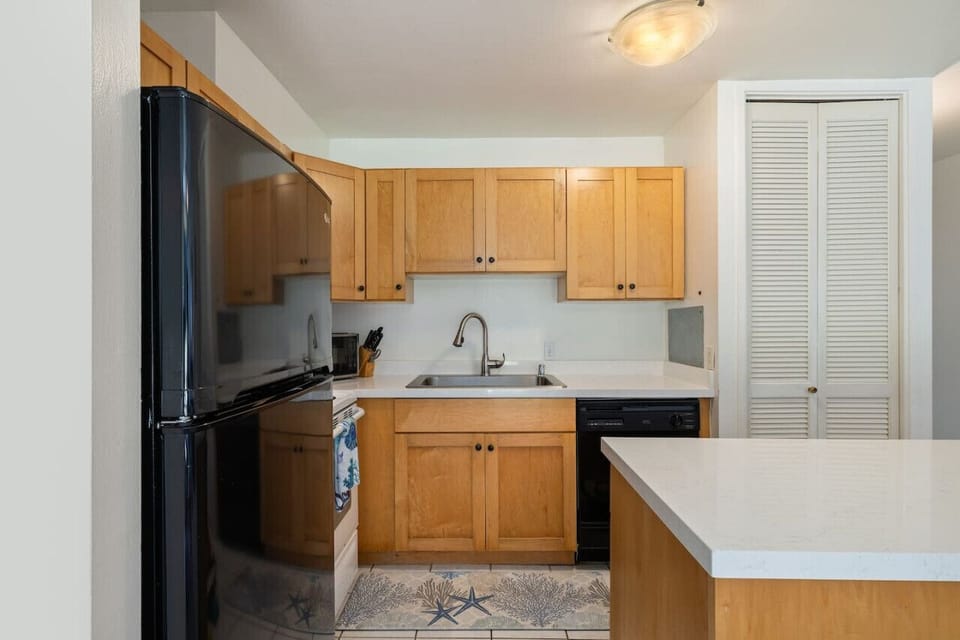 Compact kitchen nook ready for quick bites & morning coffee.