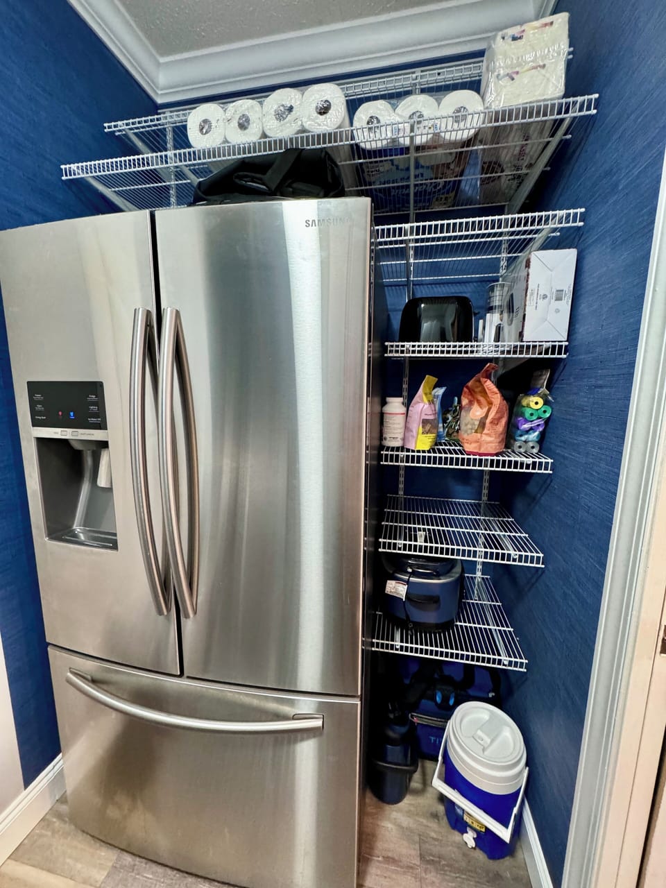 Second fridge located in laundry room.