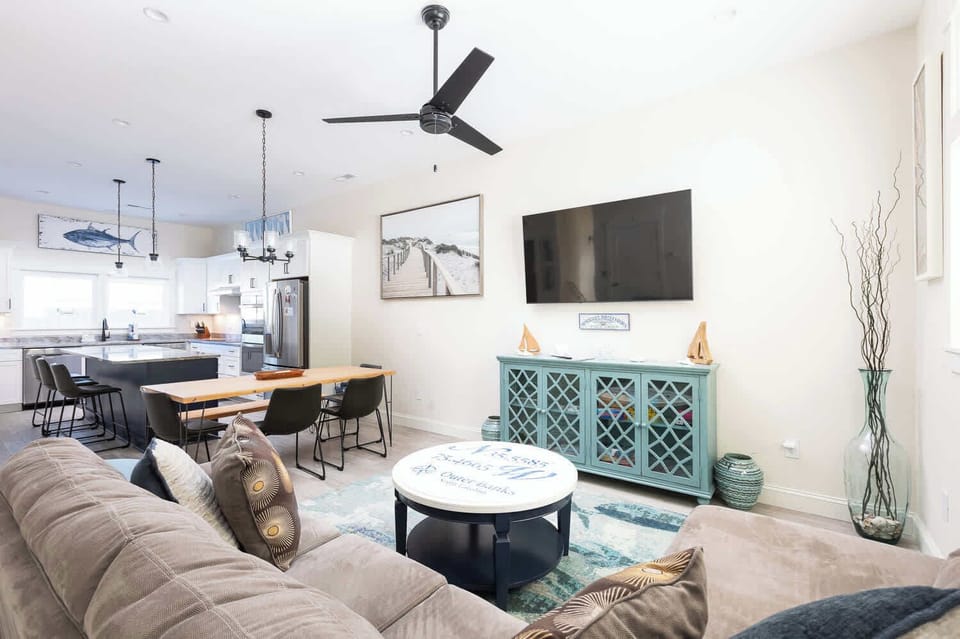 Spacious open-concept living, dining, and kitchen area perfect for gathering
