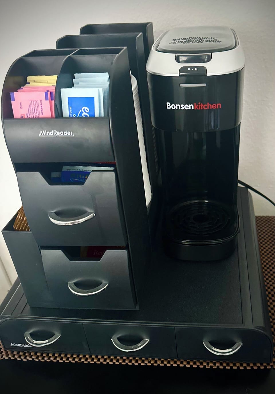 Wake up and smell the coffee .Keurig type coffee-maker with creamers and sugars