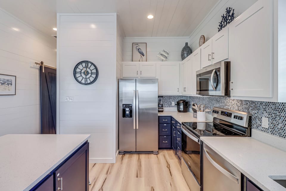 Fully equipped kitchen with appliances and all cooking equipment and utensils