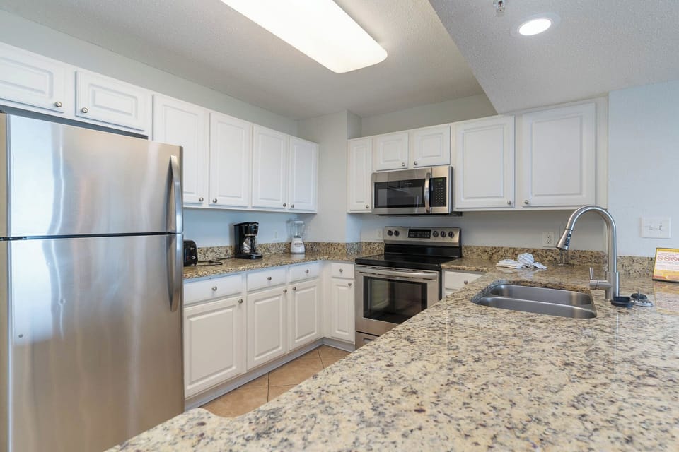 Spacious kitchen with granite countertops