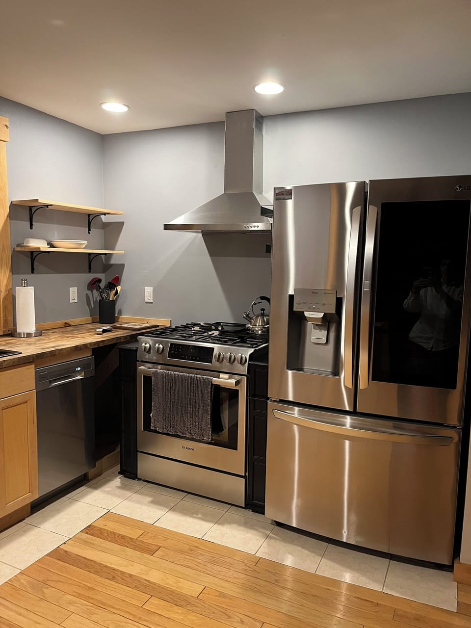 Kitchen Bosch gas oven range & LG Instaview refrigerator