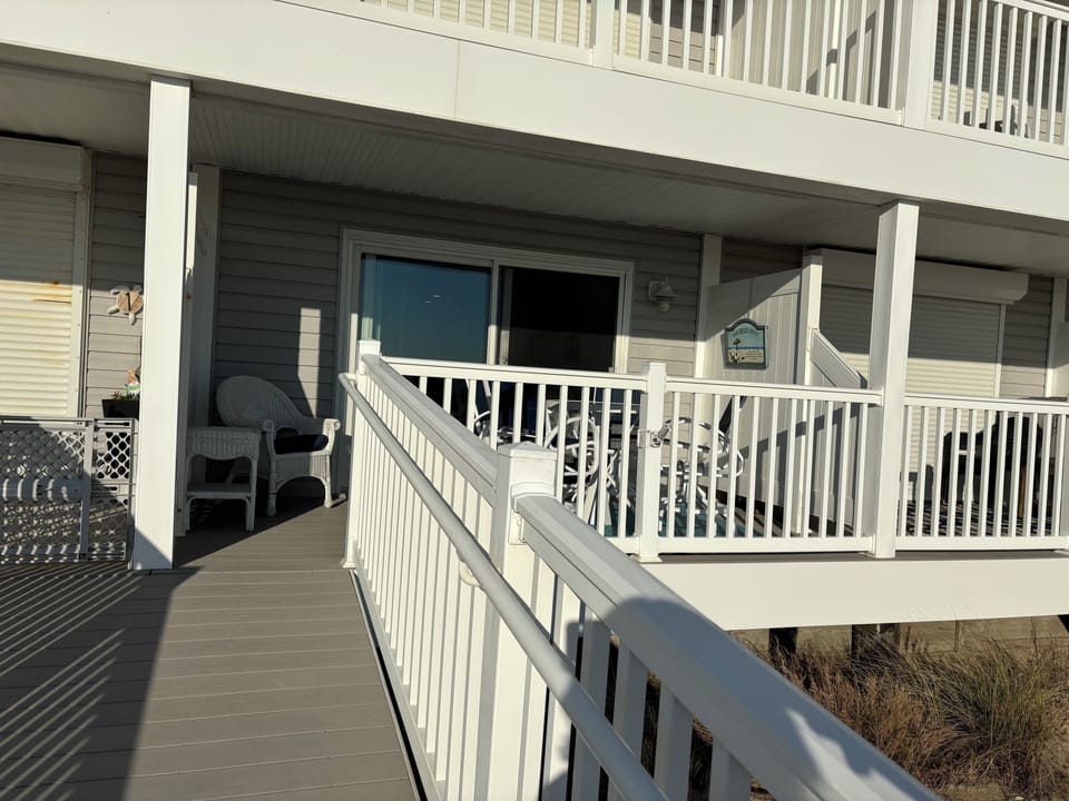 Deck w/ table & chairs. Enjoy the ocean wave sounds, sea breeze, and ocean view